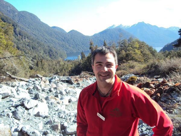 Ultimate Hikes guide Shaun Liddy at the top of the Glade Burn Milford Track